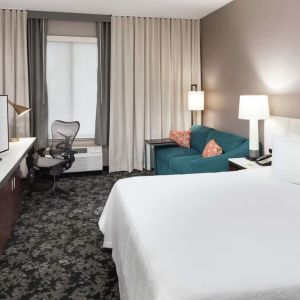 Day use room with work desk and sofa at Hilton Garden Inn Sacramento/South Natomas.