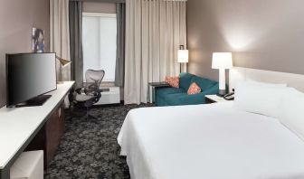 Day use room with work desk and sofa at Hilton Garden Inn Sacramento/South Natomas.