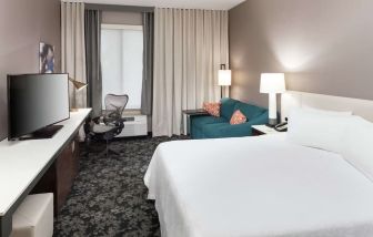 Day use room with work desk and sofa at Hilton Garden Inn Sacramento/South Natomas.