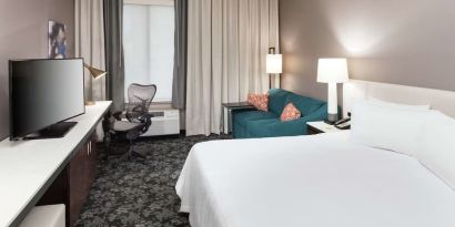 Day use room with work desk and sofa at Hilton Garden Inn Sacramento/South Natomas.