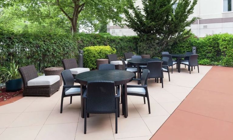 Seats in the garden available at Hilton Garden Inn Sacramento/South Natomas.