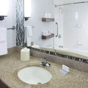 Guest bathroom with shower and tub at Hilton Garden Inn Sacramento/South Natomas.