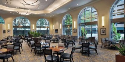 Dining area perfect for coworking at Hilton Indianapolis Hotel & Suites.