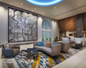 Lobby and coworking lounge at Hilton Indianapolis Hotel & Suites.