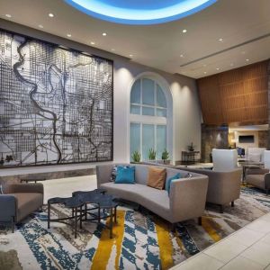 Lobby and coworking lounge at Hilton Indianapolis Hotel & Suites.