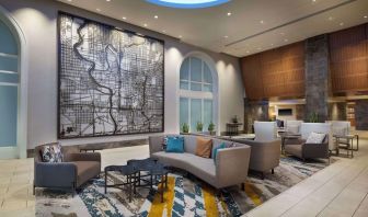 Lobby and coworking lounge at Hilton Indianapolis Hotel & Suites.