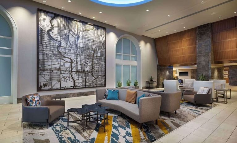 Lobby and coworking lounge at Hilton Indianapolis Hotel & Suites.