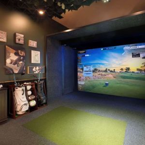 Indoor golf driving range at Hilton Indianapolis Hotel & Suites.