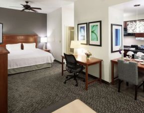 Day use room with work desk and kitchen at Homewood Suites Agoura Hills.
