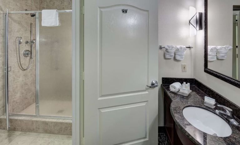 Guest bathroom with shower at Homewood Suites Agoura Hills.
