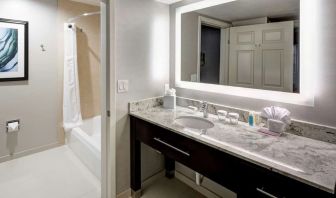 Guest bathroom with shower and tub at Homewood Suites By Hilton San Jose Airport-Silicon Valley.