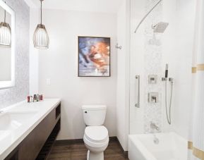 Guest bathroom with shower and tub at Marriott Del Mar.