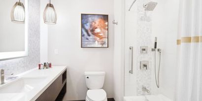 Guest bathroom with shower and tub at Marriott Del Mar.