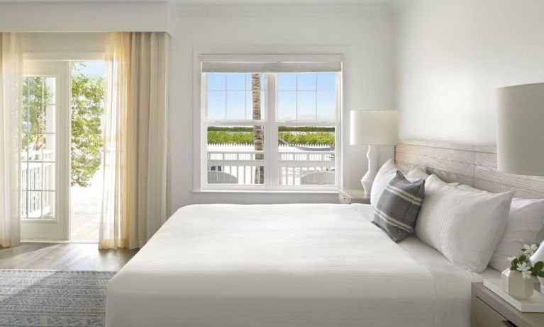 Romantic king room with natural light at Parrot Key Hotel & Villas.