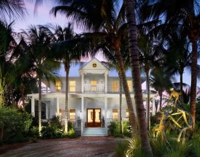 Hotel exterior at dusk at Parrot Key Hotel & Villas.