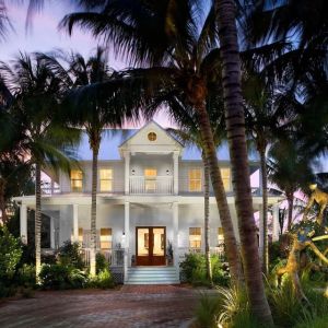 Hotel exterior at dusk at Parrot Key Hotel & Villas.