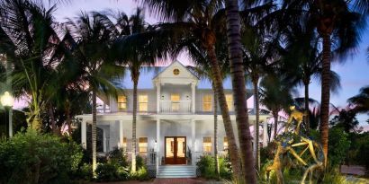 Hotel exterior at dusk at Parrot Key Hotel & Villas.