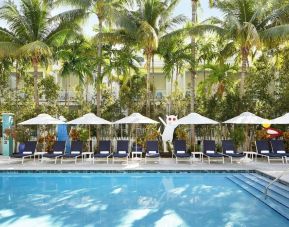 Outdoor pool with loungers at Parrot Key Hotel & Villas.