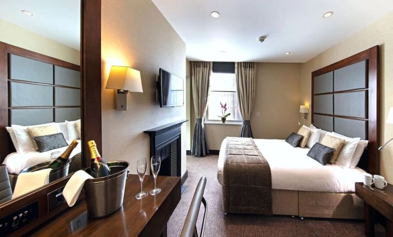 Day use queen room with work desk and fireplace at The Wellington by Blue Orchid Hotel (FKA The Rochester).