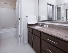 Guest bathroom with shower and tub at Residence Inn By Marriott Provo.