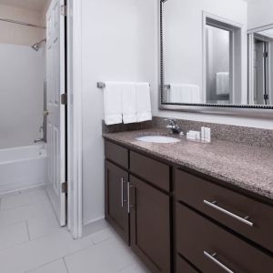 Guest bathroom with shower and tub at Residence Inn By Marriott Provo.