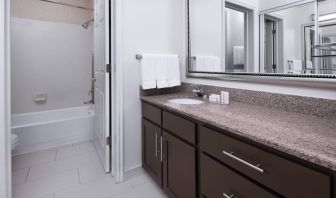 Guest bathroom with shower and tub at Residence Inn By Marriott Provo.