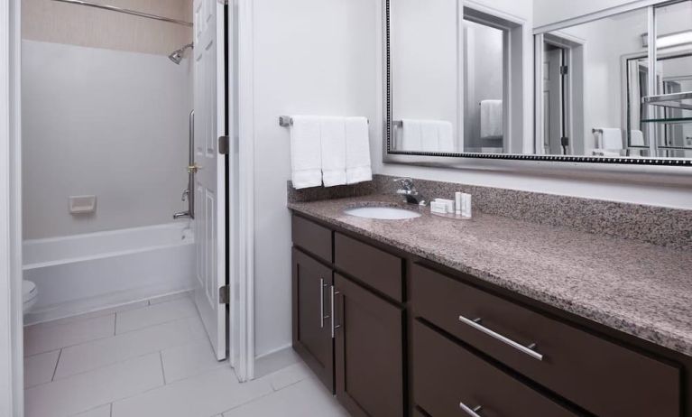 Guest bathroom with shower and tub at Residence Inn By Marriott Provo.