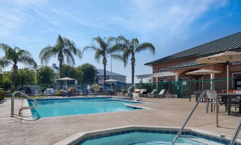 Refreshing outdoor pool and spa tub at Residence Inn Santa Clarita.