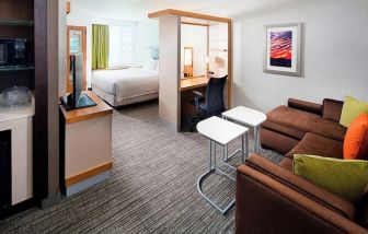 Day use room with living area at Springhill Suites Carle Place.
