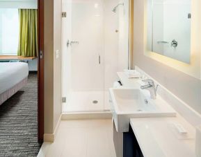 Guest bathroom with shower at Springhill Suites Carle Place.