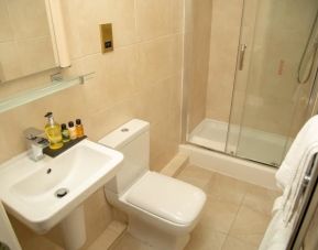 Guest bathroom with shower and free toiletries at The Ladbrooke Hotel.