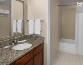 Guest bathroom with shower and tub at Residence Inn By Marriott San Diego Downtown.