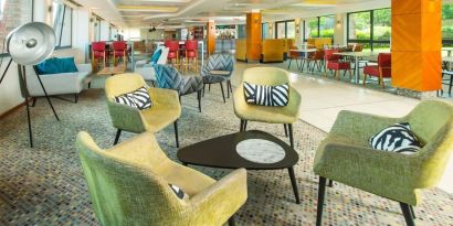 Comfortable lobby lounge at ibis Styles Birmingham NEC.