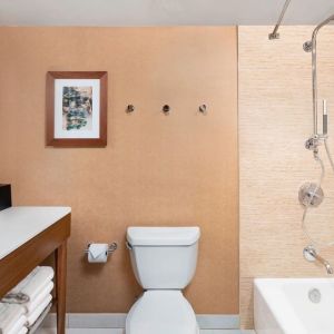 Guest bathroom with shower and tub at The Westin Crystal City Reagan National Airport.