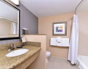 Guest bathroom with shower and tub at Courtyard By Marriott Boise West/Meridian.