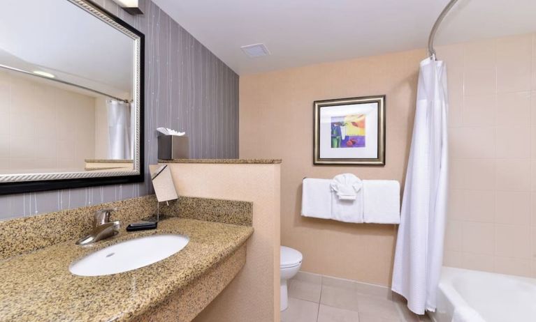 Guest bathroom with shower and tub at Courtyard By Marriott Boise West/Meridian.