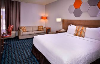 Day use room with sofa and work desk at Fairfield Inn By Marriott Las Vegas Convention Center.
