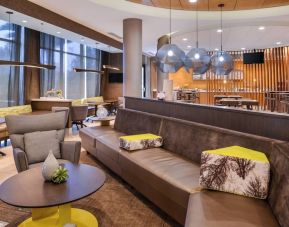 Lobby and coworking lounge at SpringHill Suites By Marriott Irvine John Wayne Airport/Orange County.