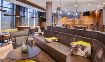 Lobby and coworking lounge at SpringHill Suites By Marriott Irvine John Wayne Airport/Orange County.