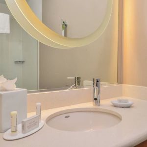 Guest bathroom with shower at SpringHill Suites By Marriott Irvine John Wayne Airport/Orange County.