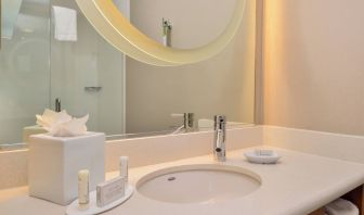 Guest bathroom with shower at SpringHill Suites By Marriott Irvine John Wayne Airport/Orange County.