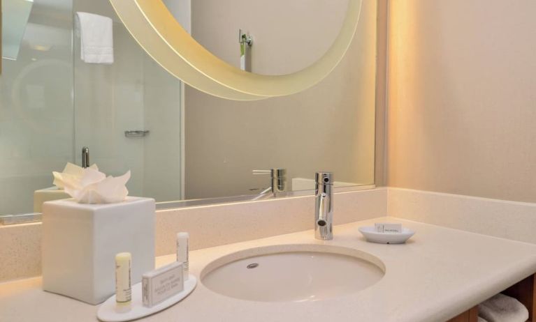 Guest bathroom with shower at SpringHill Suites By Marriott Irvine John Wayne Airport/Orange County.