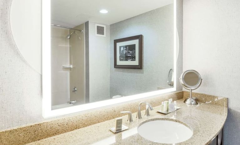 Guest bathroom with shower at DoubleTree By Hilton Austin University Area.