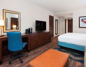 Day use room with work desk and sofa at Hilton Garden Inn Burbank Downtown.