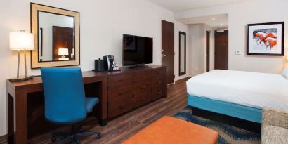 Day use room with work desk and sofa at Hilton Garden Inn Burbank Downtown.