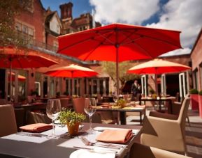 Hotel restaurant with outdoor seating at Alexander House Hotel And Utopia Spa Hotel.