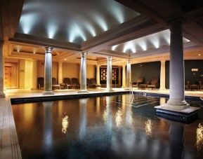 Indoor heated pool with lounge area at Alexander House Hotel And Utopia Spa Hotel.