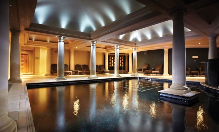 Indoor heated pool with lounge area at Alexander House Hotel And Utopia Spa Hotel.