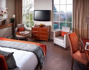 Day use king room with work desk and lounge seating at Alexander House Hotel And Utopia Spa Hotel.