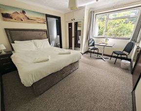 Bright and spacious day use room with lounge area at Little Foxes Hotel.